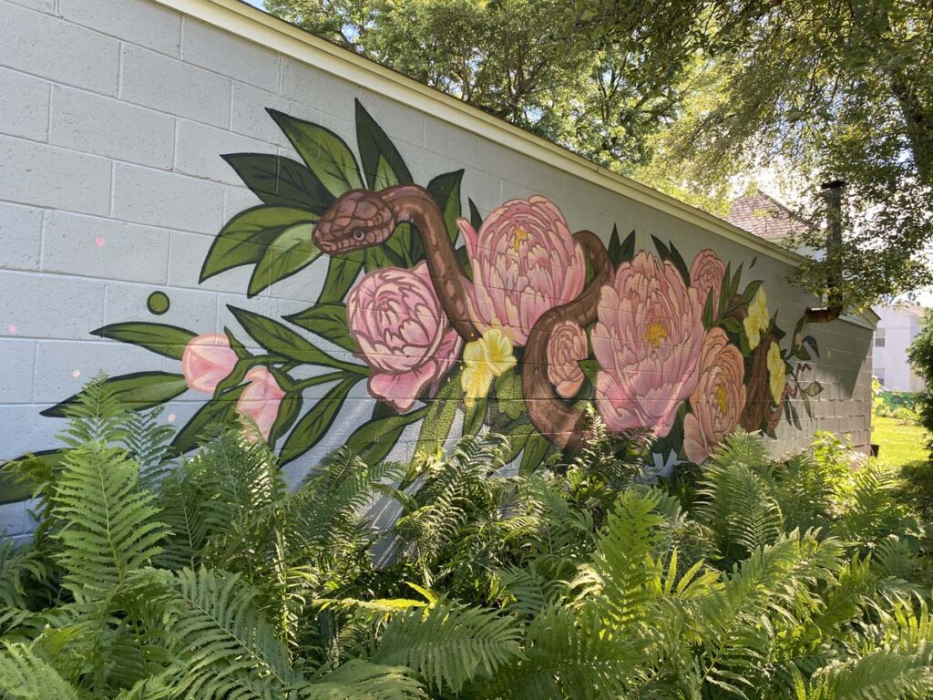 Mural of Snake and Flowers on Wall