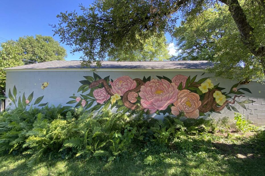 Mural of Snake and Flowers on Brick wall